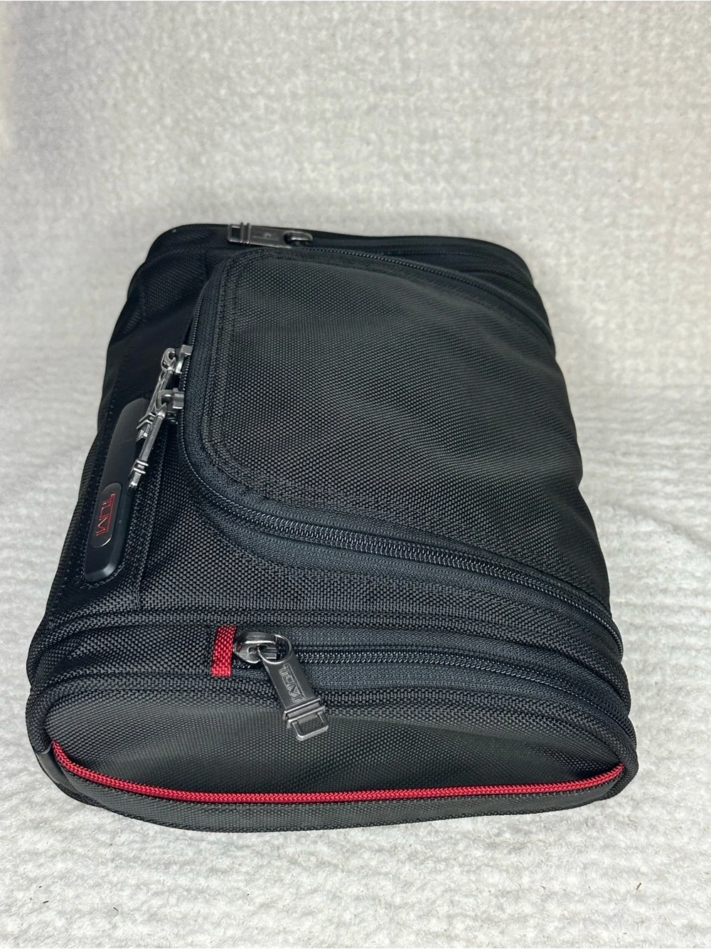Tumi Black Toiletry Bag with Red Accents
